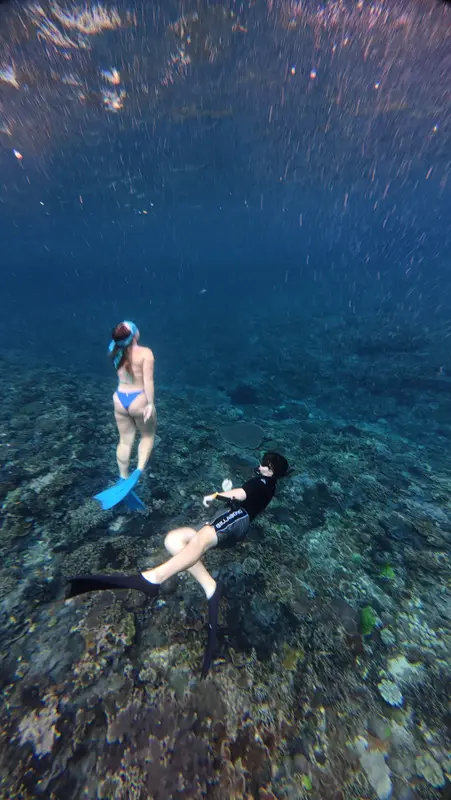 Two snorkelers exploring a coral garden in Nusa Penida